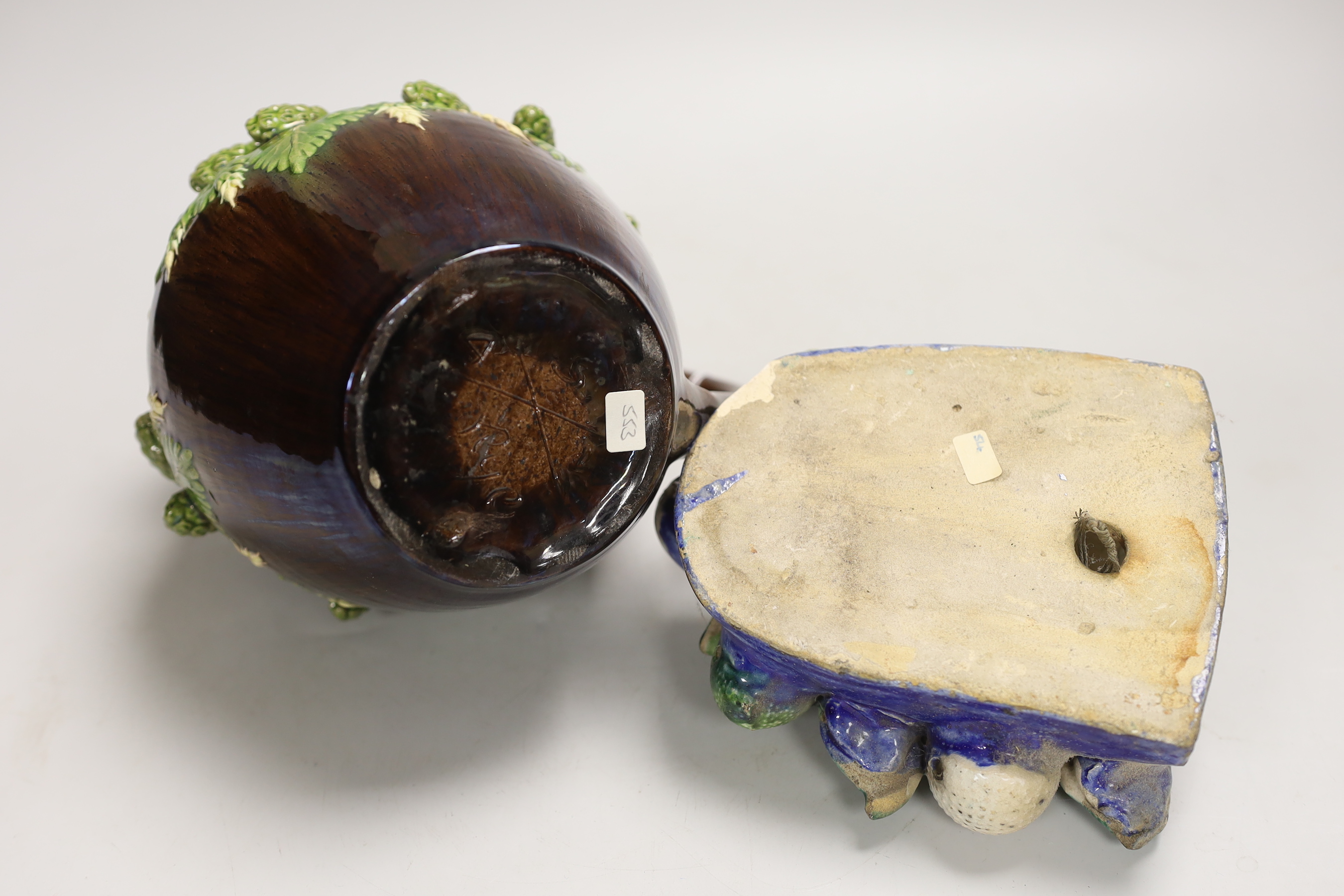 A Portuguese maiolica pottery wall pocket, a Rye pottery jug and three creamware dolls house plates
